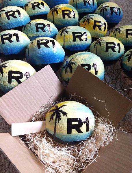 Painted coconuts make innovative corporate mailer ideas