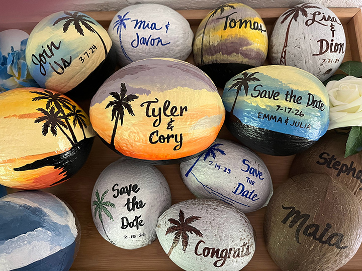 Painted coconuts for wedding place cards, event invitations and save the dates announcements