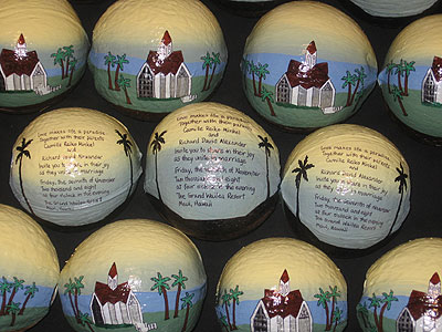 Hand painted invitations on hollow coconuts
